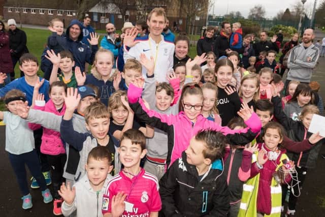 Alex Teuten with the participants at Eastney junior parkrun. Picture: Duncan Shepherd