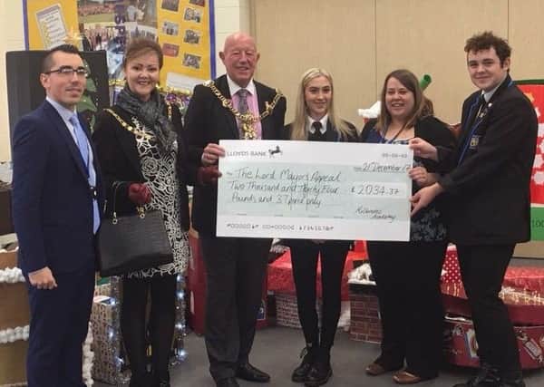 Lord Mayor Cllr Ken Ellcome and Lady Mayoress Jo Ellcome receiving a cheque from Miltoncross Academy pupils and staff