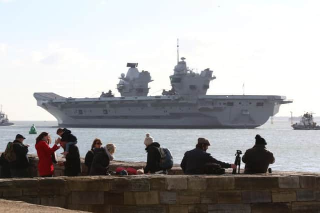 HMS Queen Elizabeth draws a crowd at the waterfront as she sets sail.
Picture: Habibur Rahman