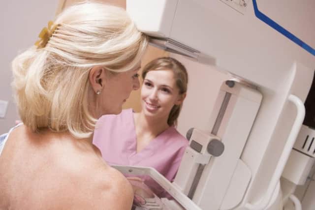 A woman being screened for breast cancer