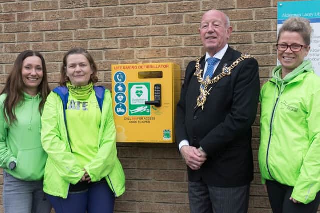 Helen Mayhead, Kate English, the Lord Mayor of Portsmouth Councillor Ken Ellcome, and Julie Fuller at the unveiling of the defibrillatorin Baffins.
Picture: Keith Woodland