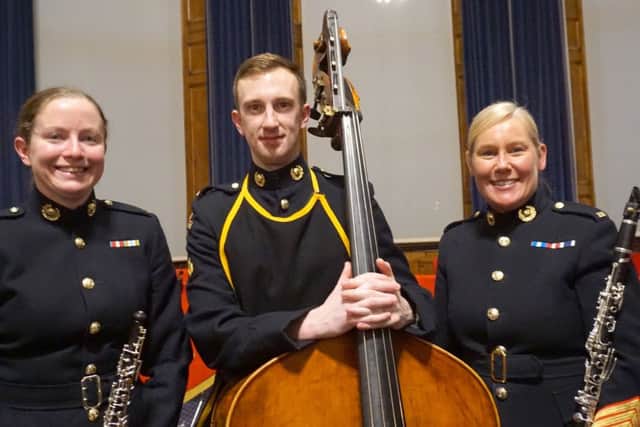 From left: Corporal Angela Duggan with musicians Joe Robbins and Rachel Wright