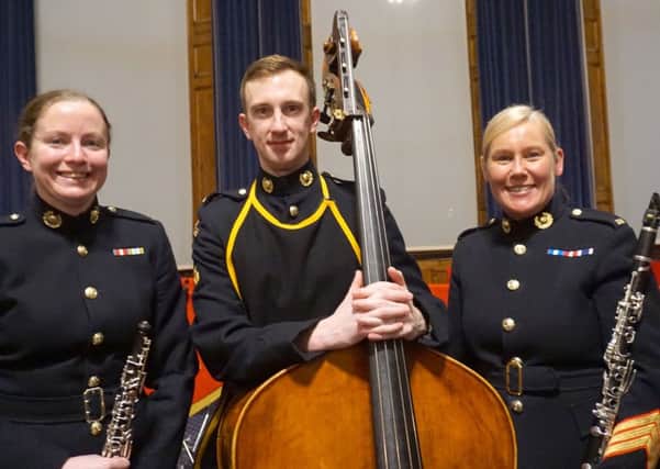 From left: Corporal Angela Duggan with musicians Joe Robbins and Rachel Wright