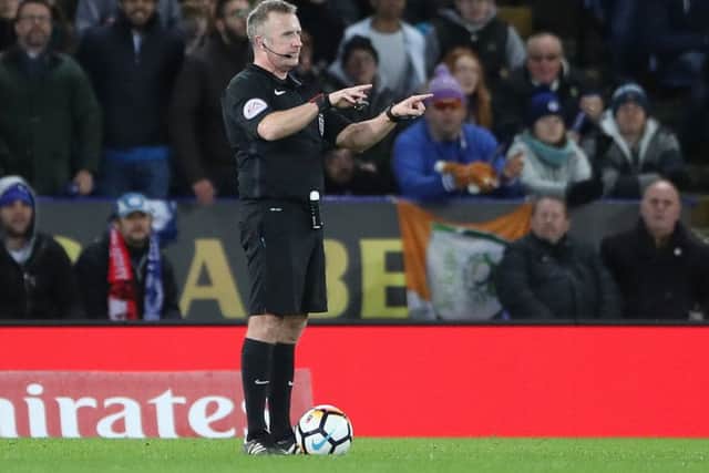 Referee Jonathan Moss consults VAR before giving Leicester City's second goal to Kelechi Iheanacho during the FA Cup replay against Fleetwood Town