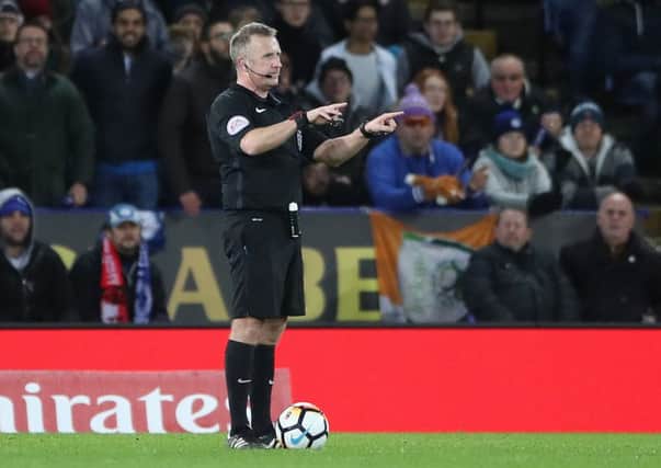 Referee Jonathan Moss consults VAR before giving Leicester City's second goal to Kelechi Iheanacho during the FA Cup replay against Fleetwood Town