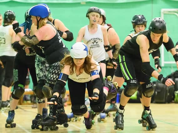 Portsmouth Roller Wenches and Portsmouth Scurvy Dogs in action on the track