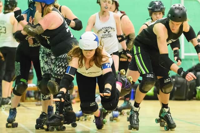 Portsmouth Roller Wenches and Portsmouth Scurvy Dogs in action on the track