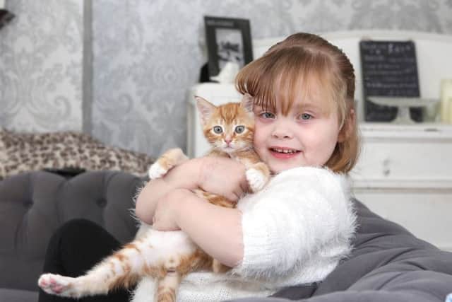 Ivy Weir with her pet kitten, Tormund