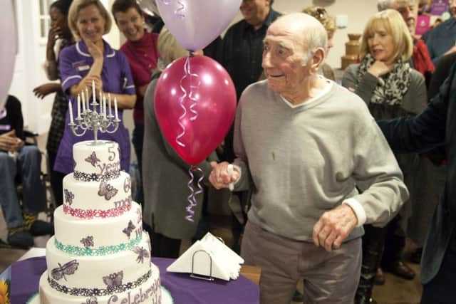 Resident Eric Morey is pictured with the celebration cake  as Hamble Heights care home in Fareham celebrates its fifth anniversary