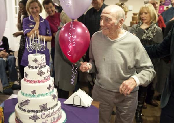 Resident Eric Morey is pictured with the celebration cake  as Hamble Heights care home in Fareham celebrates its fifth anniversary