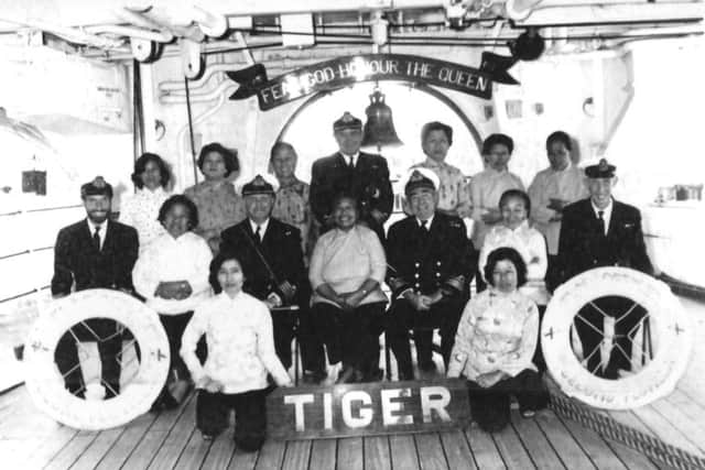 Jenny, centre, with Rear Admiral Martin Weymess on her right as we look as we look at the picture.  Picture courtesy Tom Brierley