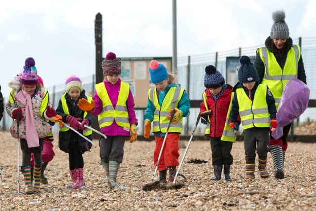 The children are fully-equipped for picking up lots of litter mikeowensphotography.com