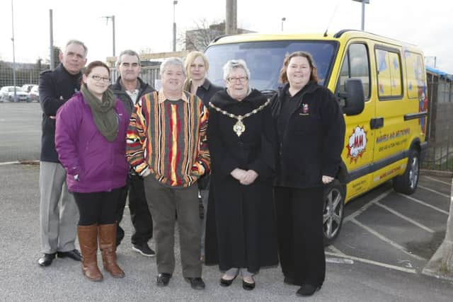 Glenn Ford, Tricia Lyons, Rob McDowell, Les Heyhoe, Sarah McDowell, Mayor Linda Batty and Shandrika Day in front of the new bus     Picture: Habibur Rahman