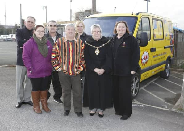 Glenn Ford, Tricia Lyons, Rob McDowell, Les Heyhoe, Sarah McDowell, Mayor Linda Batty and Shandrika Day in front of the new bus     
Picture: Habibur Rahman