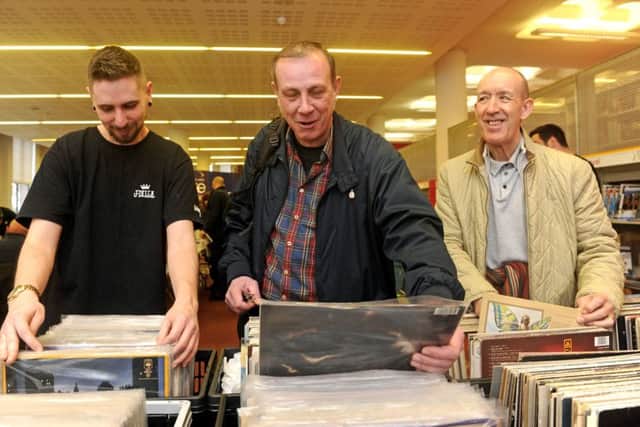 Music fans Sam Stokes, Lee Amey and Dave Kirby have a good nose through the vinyl
Picture Ian Hargreaves (180191-04)