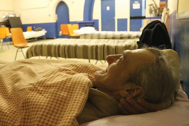 Waldemar, a guest getting ready for bed at St Simons Church as part of the Open Church project