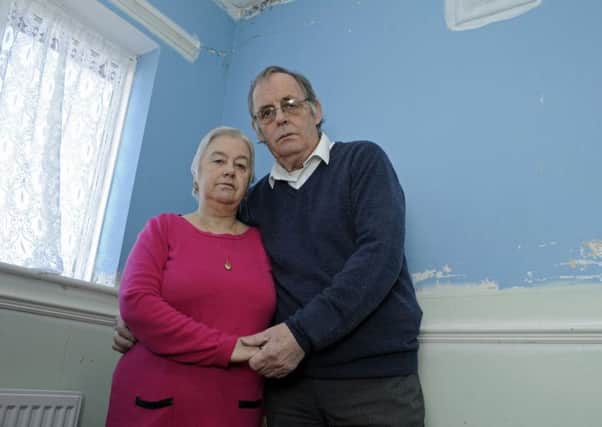 Vena and Stan Auld who have asked the News to help them sort out their cavity wall insulation problem at their home in Paulsgrove     
Picture Ian Hargreaves  (180194-1)