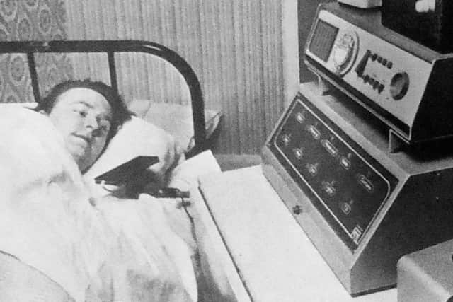 Barry Hazley at his home with the electronic equipment which allows him to operate the telephone, the television and front door without moving out of his bed