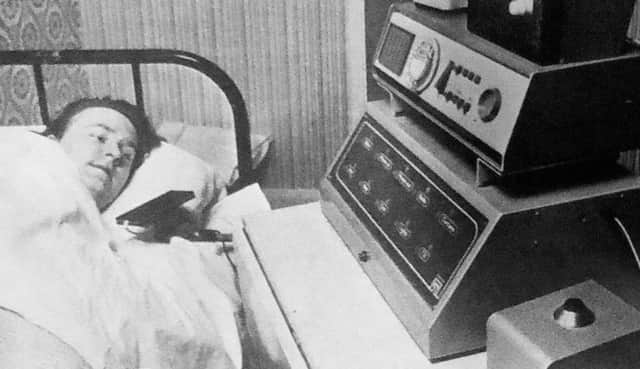 Barry Hazley at his home with the electronic equipment which allows him to operate the telephone, the television and front door without moving out of his bed