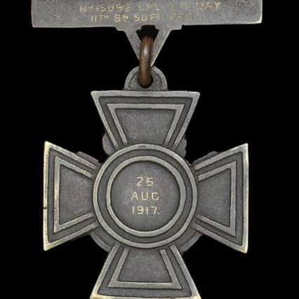 The reverse of Sidney Days Victoria Cross engraved with his name and the date on which he won Britains highest gallantry decoration