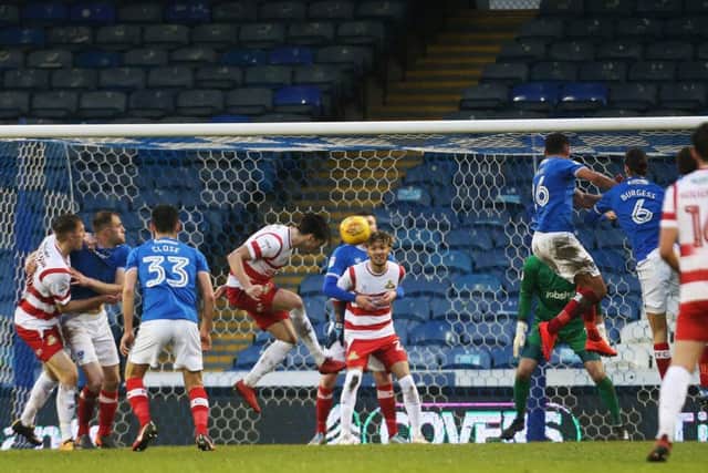 Doncaster's John Marquis nods home. Picture: Joe Pepler