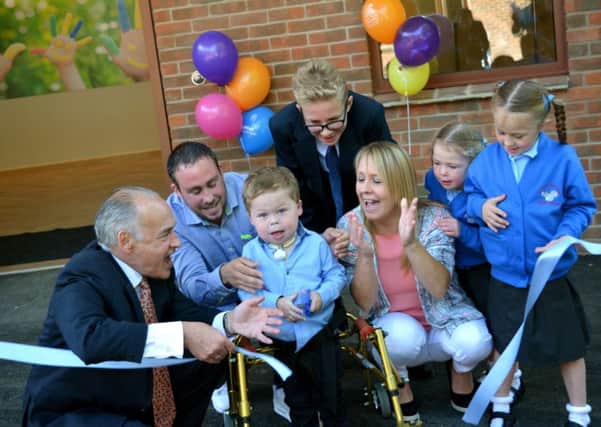 Five-year-old Mikey Strachan and his family, from Stubbington, officially open refurbished Naomi House in 2015