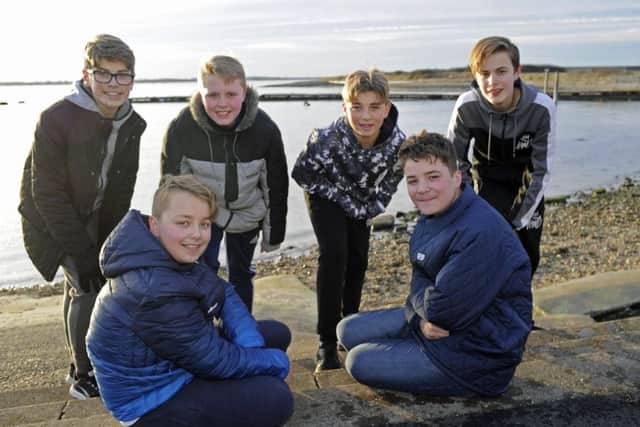 Josh Spaven, front left, with his twin brother Aaron who was rescued by a group of pals after he fell into the sea at Tipner  from left:  Bradley Willmott, Sam Ward, Kai Renault and James Humpleby                                Picture: Ian Hargreaves (180197-1)