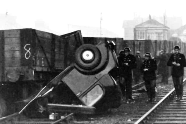 The doctors car under the wheels of a five-plank wagon. He escaped with minor injuries.