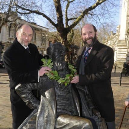 CELEBRATIONS A picture from last year when Charles Dickens great-great grandsons Ian Dickens, left, and Gerald Dickens laid a wreath on his statue in Guildhall Square to mark his anniversary Picture: Ian Hargreaves