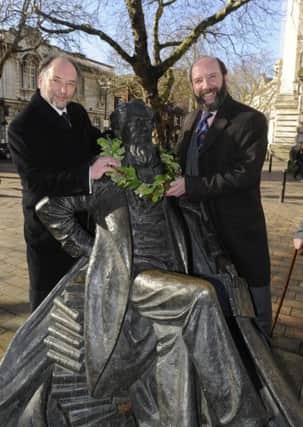 CELEBRATIONS A picture from last year when Charles Dickens great-great grandsons Ian Dickens, left, and Gerald Dickens laid a wreath on his statue in Guildhall Square to mark his anniversary Picture: Ian Hargreaves