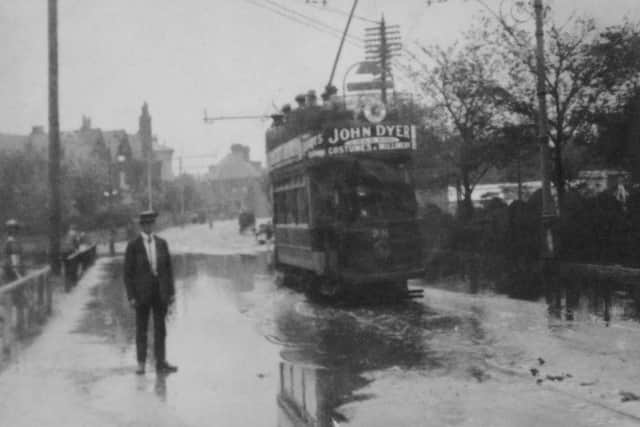 In the first third of the last century we see a packed tram travelling east along a flooded Clarendon Road, Southsea. (Barry Cox collection)