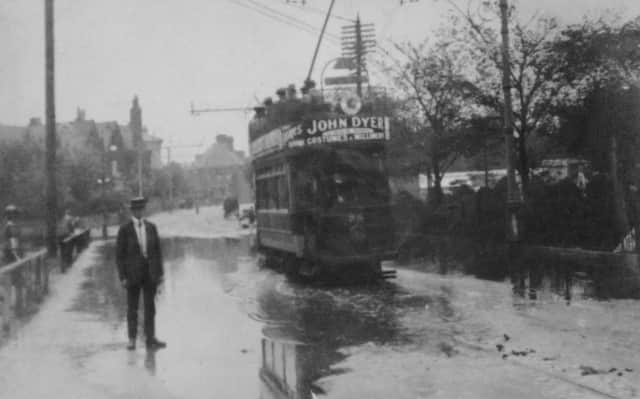 In the first third of the last century we see a packed tram travelling east along a flooded Clarendon Road, Southsea.  (Barry Cox collection)