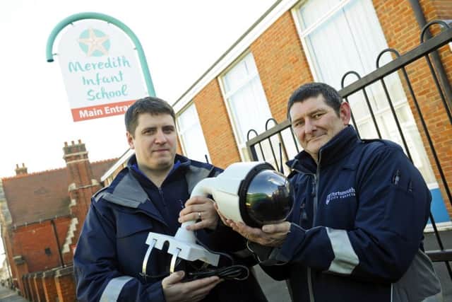 Portsmouth City Council staff Matt Crowder and Ian Maund with one of the new CCTV camera units to be installed outside Meredith Infant School Picture:  Malcolm Wells (180212-6112)