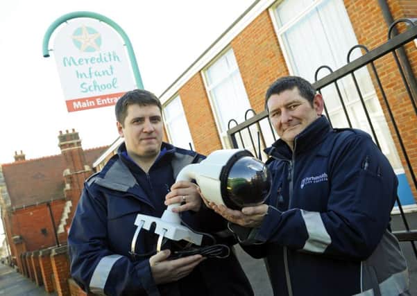 Portsmouth City Council staff Matt Crowder and Ian Maund with one of the new CCTV camera units 
to be installed outside Meredith Infant School 
Picture:  Malcolm Wells (180212-6112)