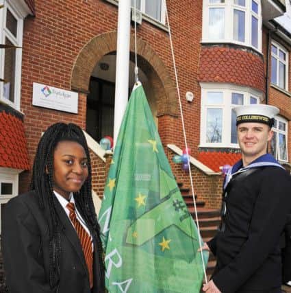 Jaya Taylor smiles proudly with her escort from HMS Collingwood  (180205-5403)
