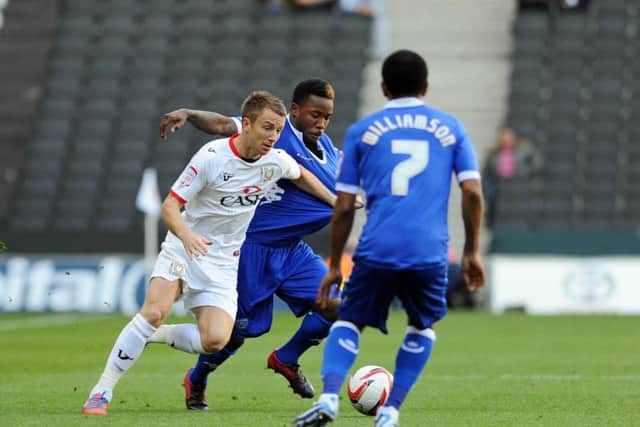 Mustapha Dumbuya in action against MK Dons in October 2012