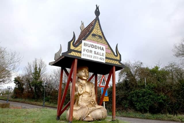 The giant Buddha statue for sale at the former Bahn Thai, Wickham Road, Fareham.  Picture: Habibur Rahman