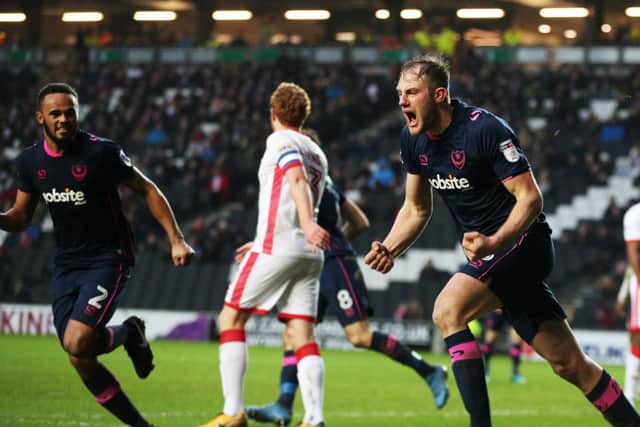 Matt Clarke scores the equaliser for Pompey in the 84th minute in their League One match against MK Dons. Picture: Joe Pepler/Digital South.