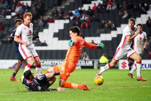 Conor Chaplin nets the win against MK Dons. Picture: Joe Pepler