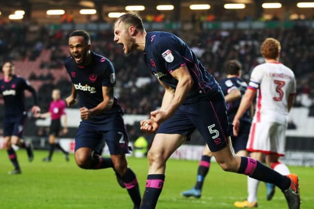 Matt Clarke celebrates netting at MK Dons. Picture: Joe Pepler