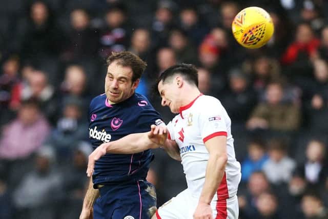 MK Dons were beaten by Pompey's late charge. Picture: Joe Pepler