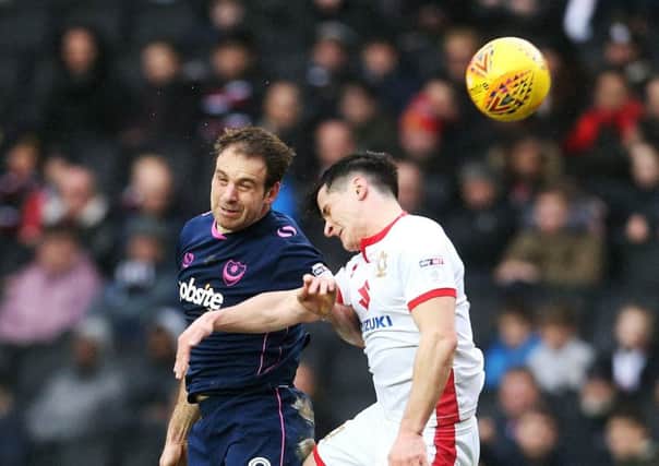 MK Dons were beaten by Pompey's late charge. Picture: Joe Pepler