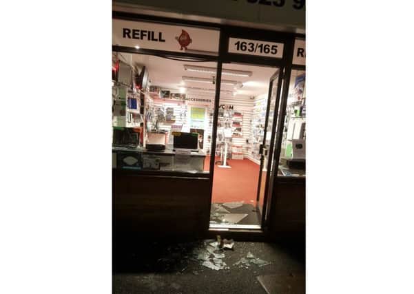 A smashed window at The Refill Centre on Stoke Road, Gosport last night