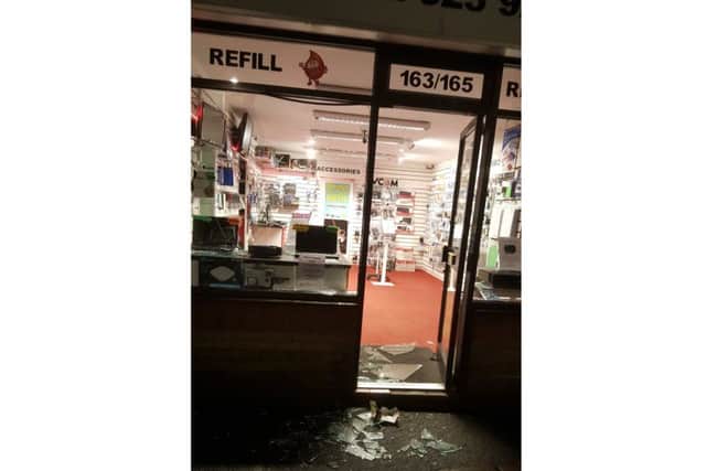 A smashed window at The Refill Centre on Stoke Road, Gosport last night