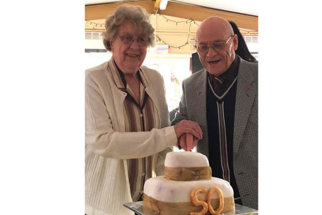 June Gover and John Sutton cut the cake to celebrate the half-century since Ladywood House was completed
