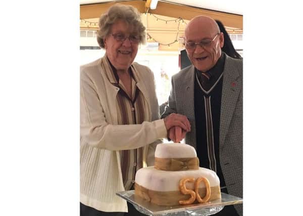 June Gover and John Sutton cut the cake to celebrate the half-century since Ladywood House was completed