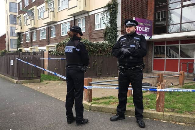 Officers stand guard outside Oldbury House, in Sackville Street, Southsea, after a teenager was found seriously-injured