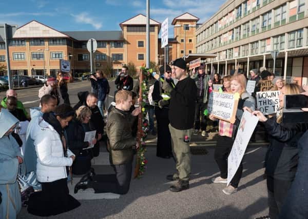 The two protest groups face eachother in the grounds of St Mary's Hospital. Picture: Vernon Nash