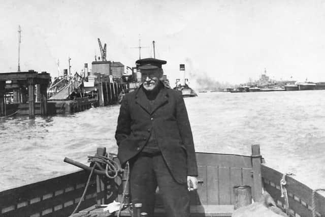 Pictured at the helm of his barge we see regular Portsmouth Harbour waterman Richard (Dickie) Dyer.