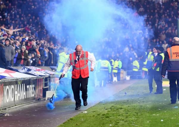 Smoke from a flare at the MK Dons v Pompey match on Saturday. Picture: Jane Russell